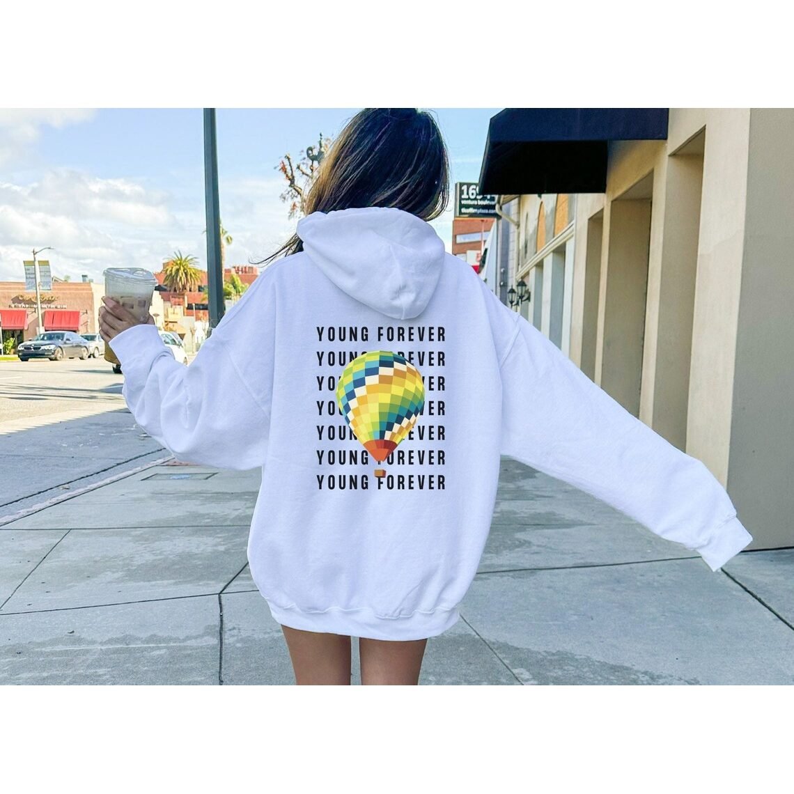 BTS Hoodie with fan-made Young Forever album art design, worn casually